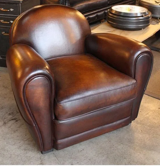 Art-Deco brown leather club chair after full restoration